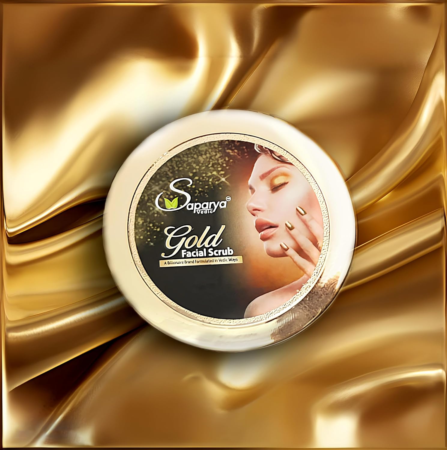 Saparya Gold Facial Scrub container on a gold fabric background