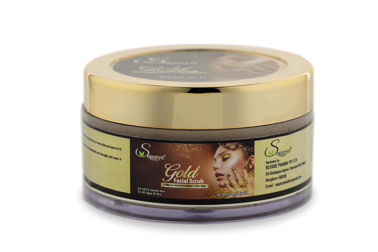 Gold facial scrub jar with a gold lid on a white background